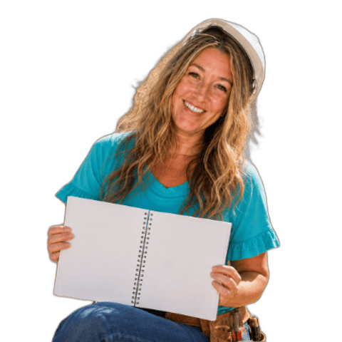 Jenny holding an open notebook for 7 Steps to Your First Quiet Launch